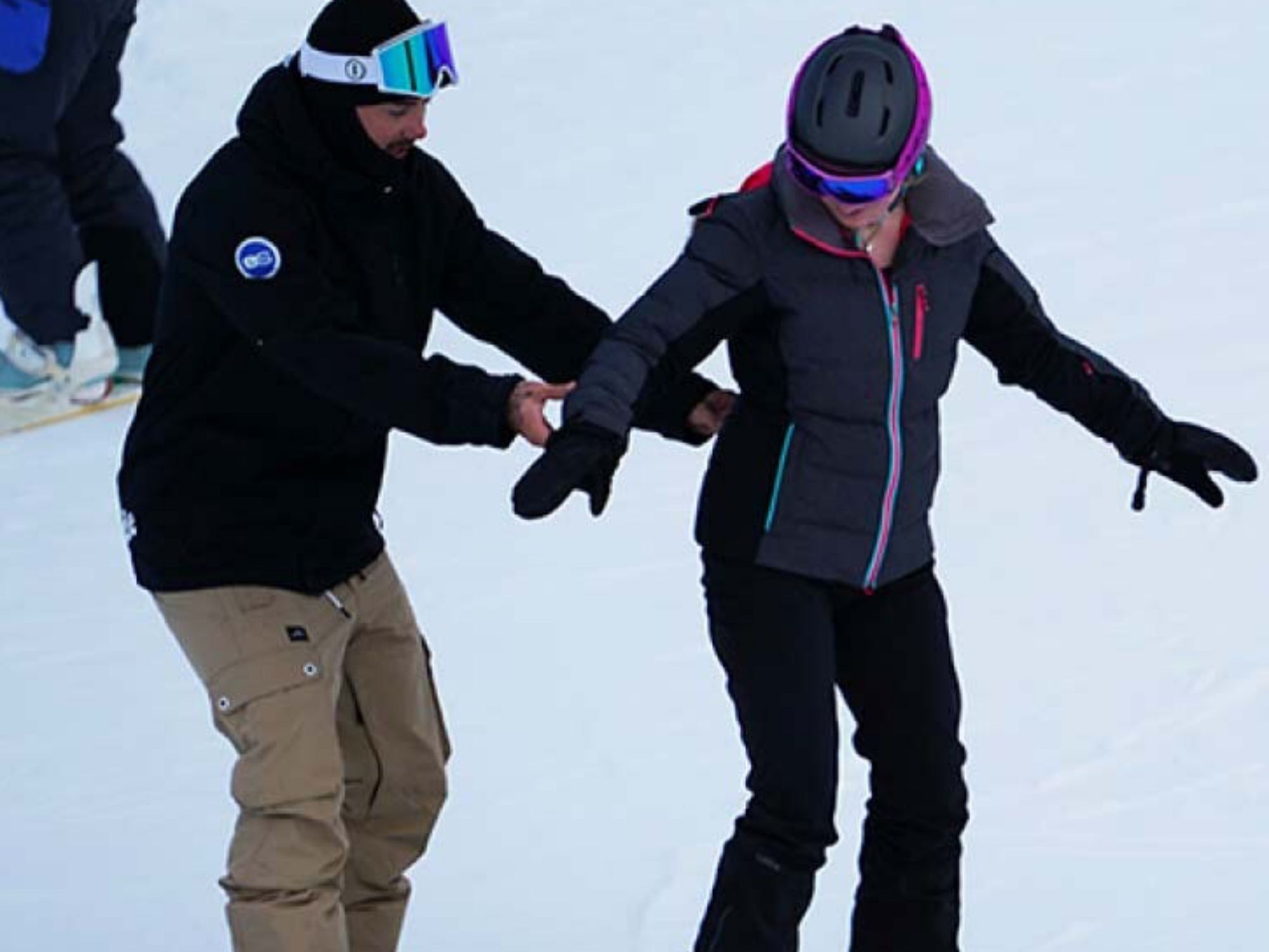 Snowboarder mit Lehrer