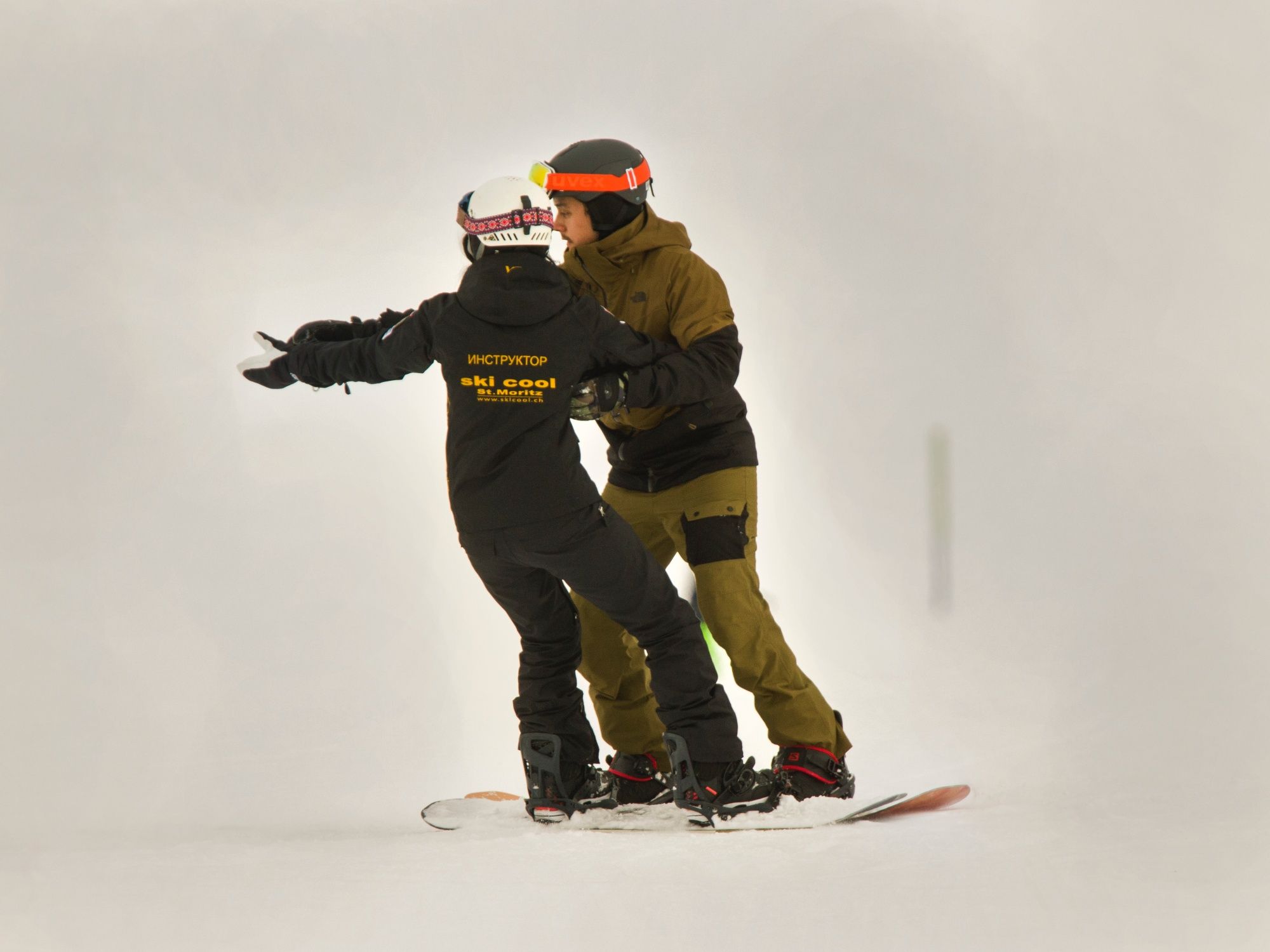 Snowboarder mit Lehrer