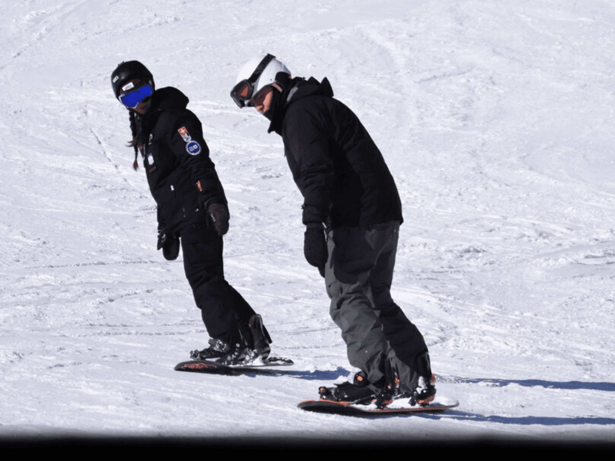 Snowboarder mit Lehrer