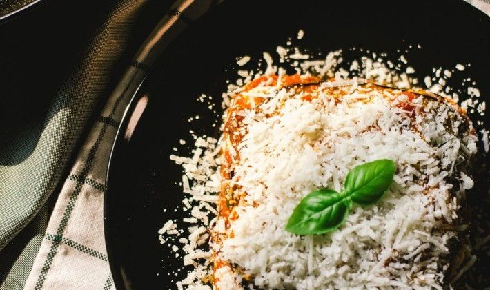 Sicilian food with cheese and basil on a plate.