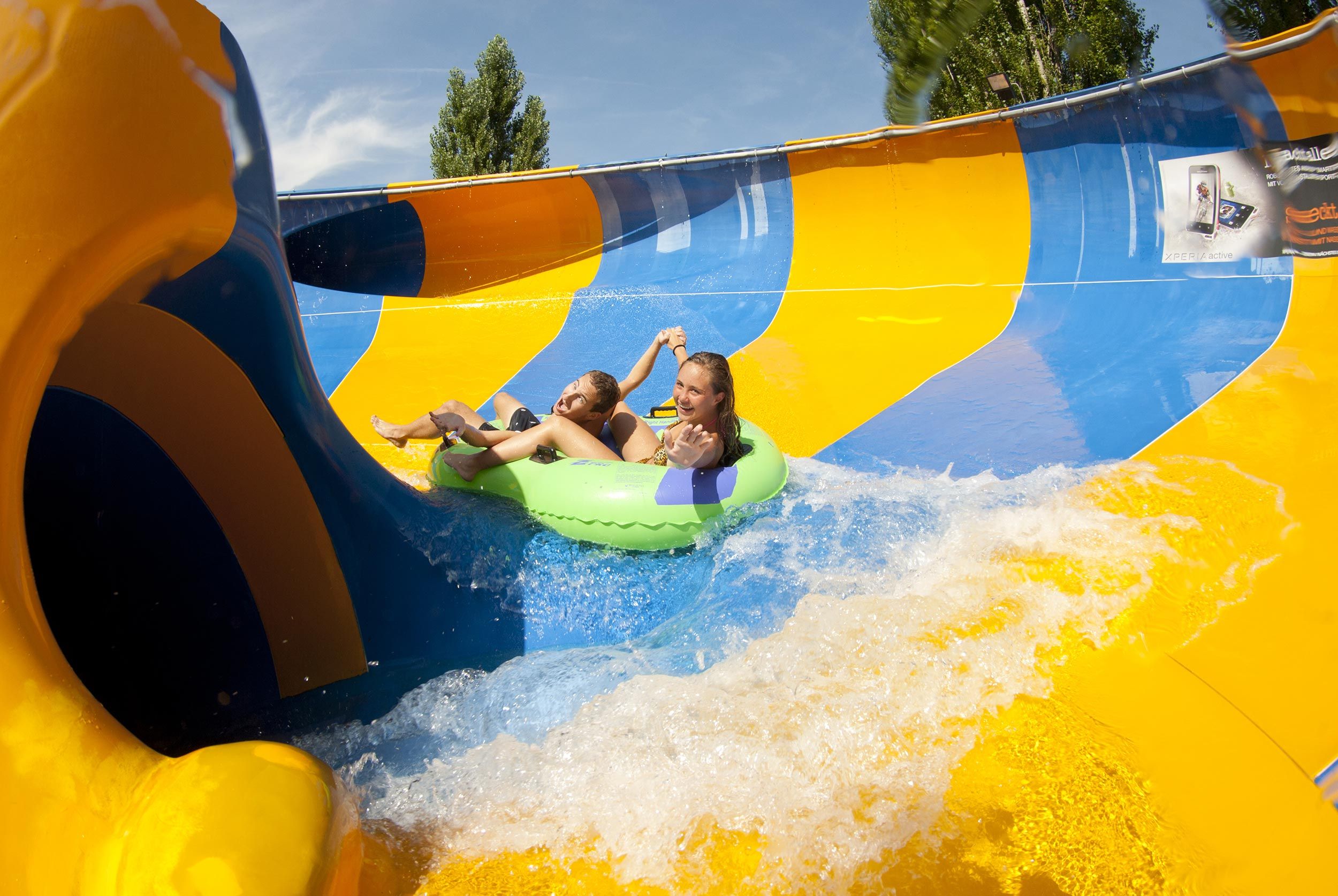 Alpamare Water Park with slides, children, and water activities.