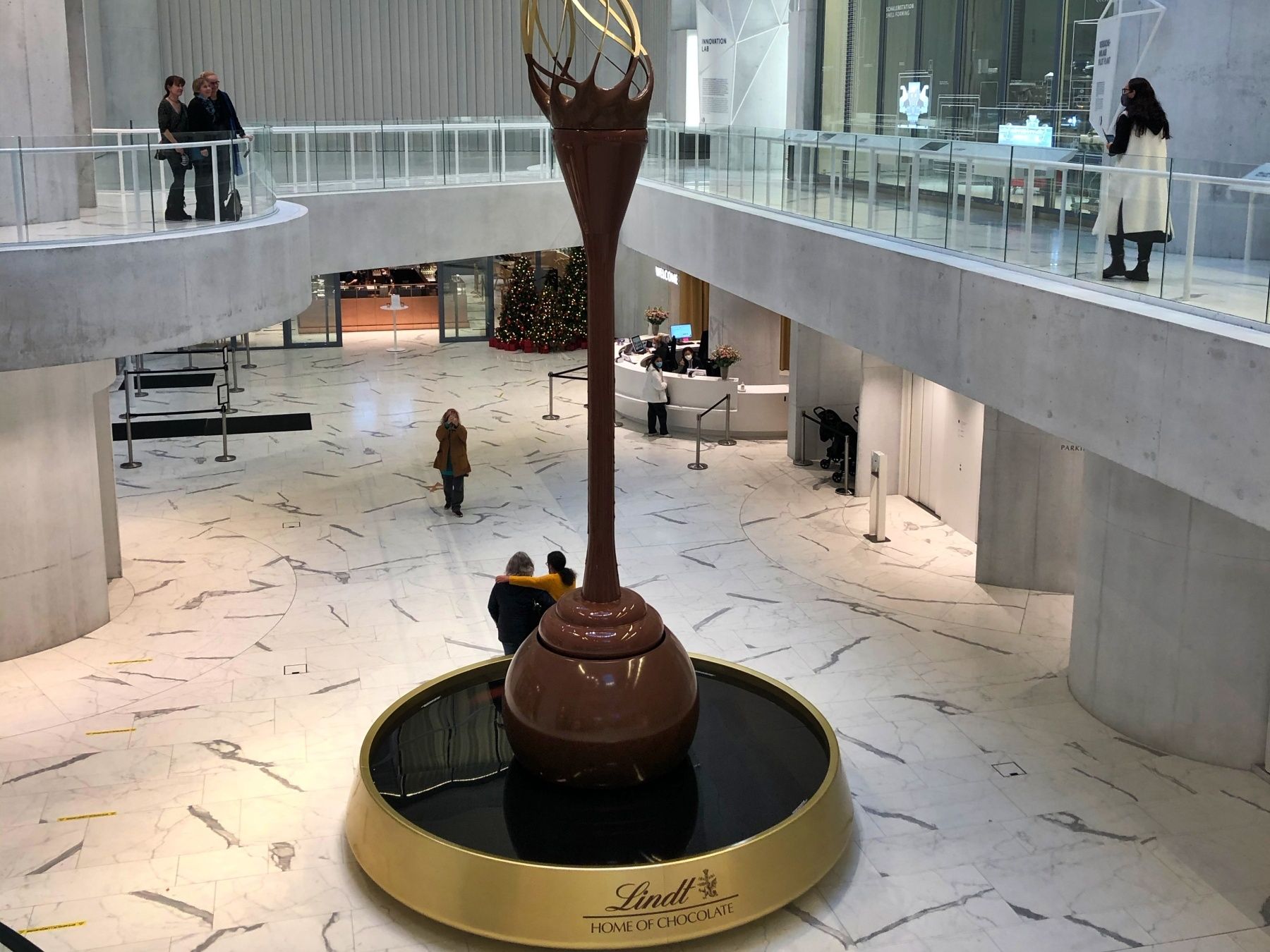 Chocolate fountain at the Lindt Home of Chocolate with impressive architecture and chocolate enjoyment.