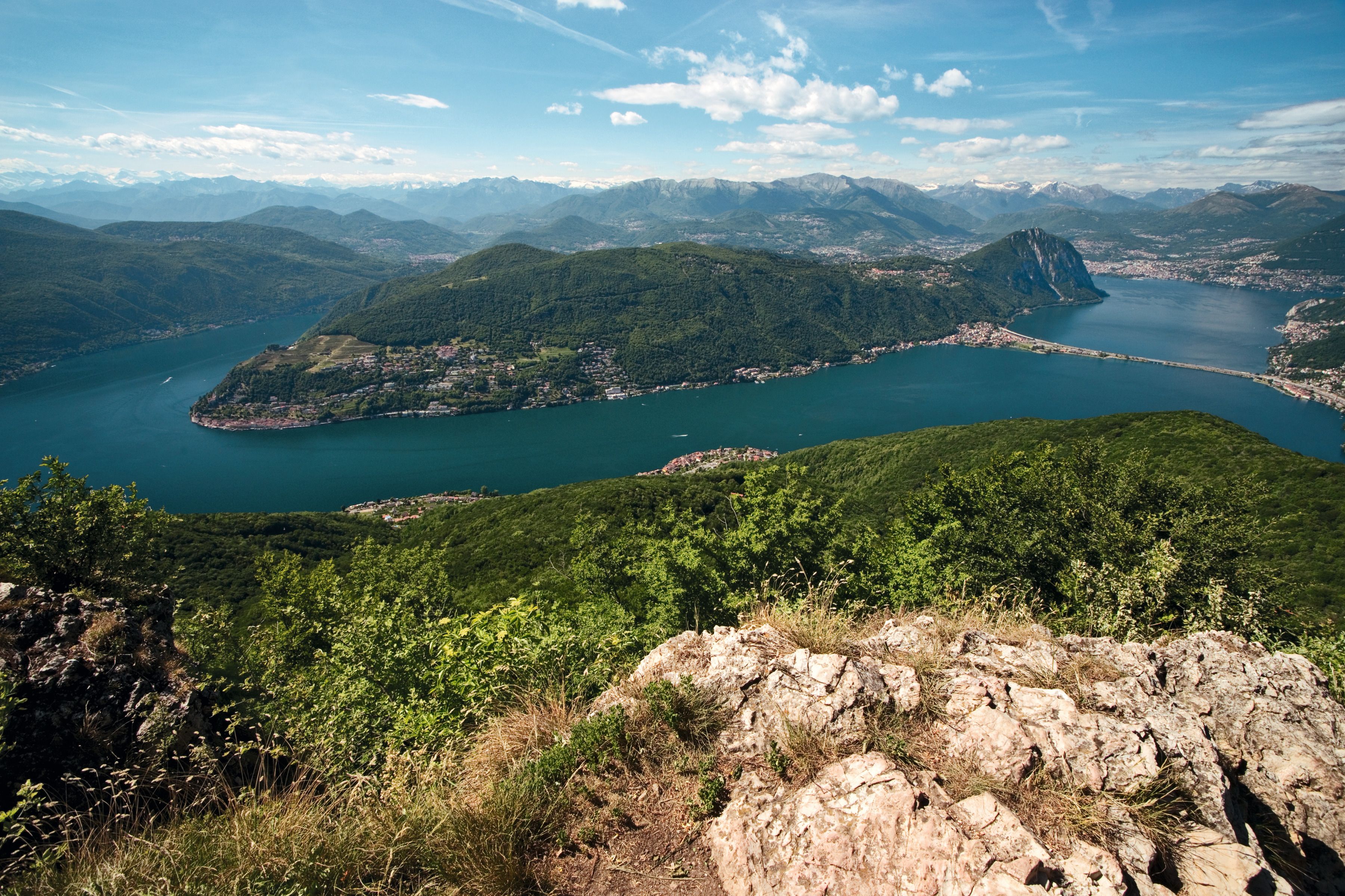 Monte San Salvatore: impressive view of Lake Lugano and surrounding mountains in Switzerland.