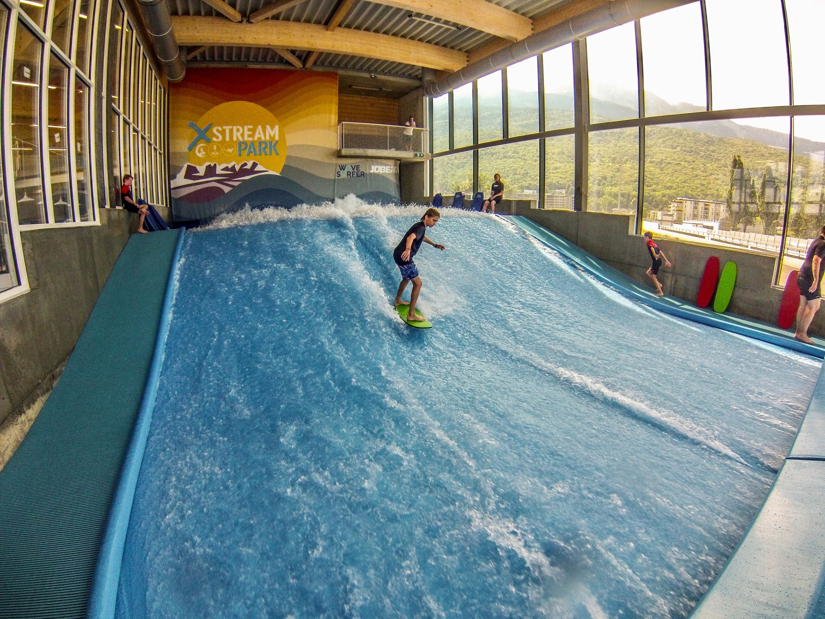 Wavesurfing at Xstream Park: Experience exciting water sports for kids and adults.