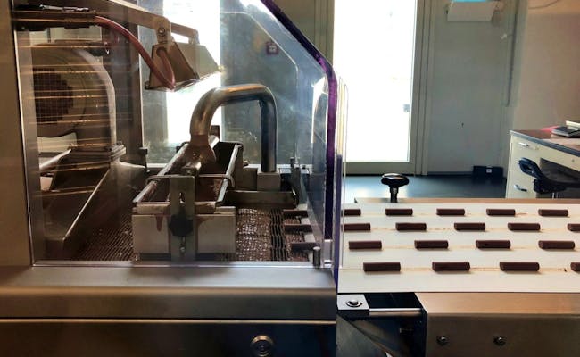 Maison Cailler: Indblik i chokoladeproduktionen i chokoladefabrikken med avanceret teknologi.
