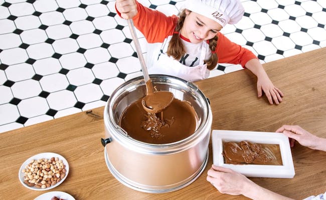 Chocolate factory: children prepare delicious chocolate in the Chocolarium during bad weather.