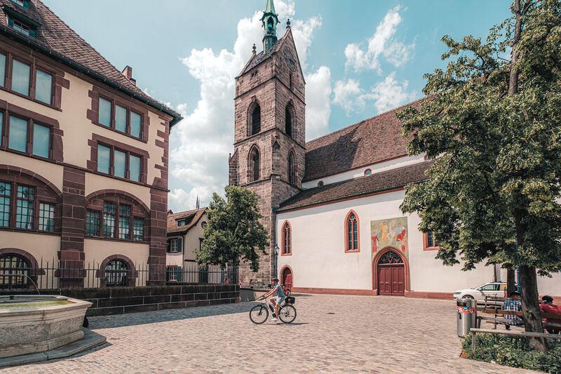 City tour Basel. Bicycles along the Martinskirche in the city center.