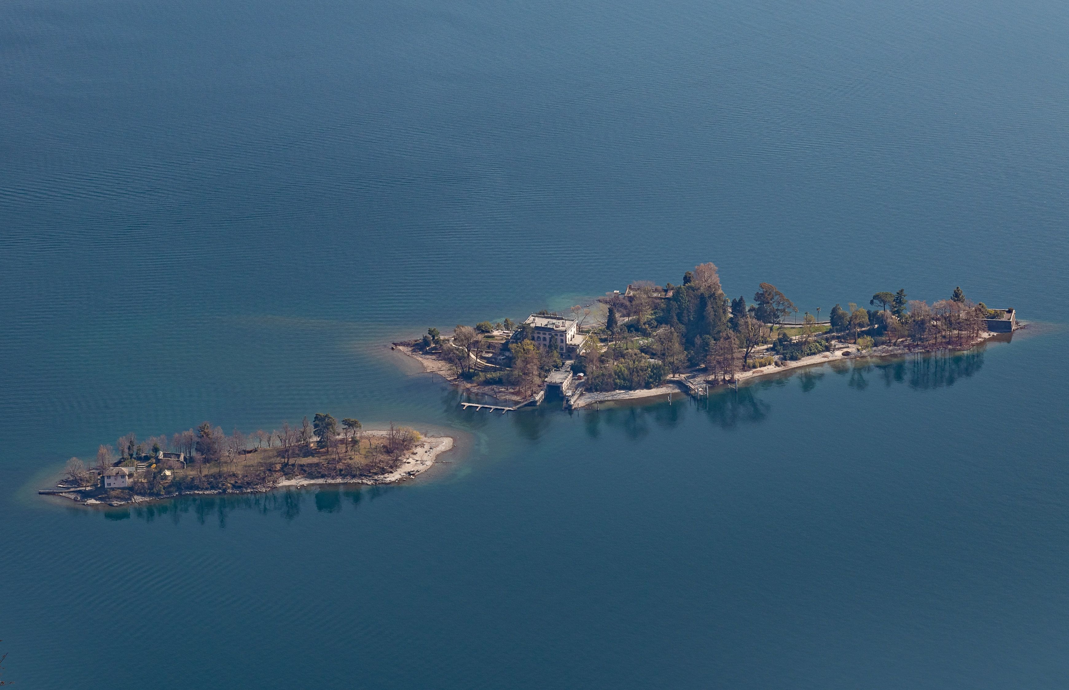 Brissago Islands: picturesque landscape in summer with lush vegetation and clear water.