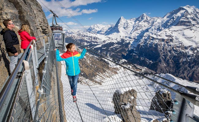 Schilthorn: Panorama view from the Thrill Walk in Birg of the impressive Alps and snow-capped mountains.