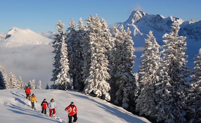 Snowshoe hiking on the Twäregg Trail in Switzerland in the snow