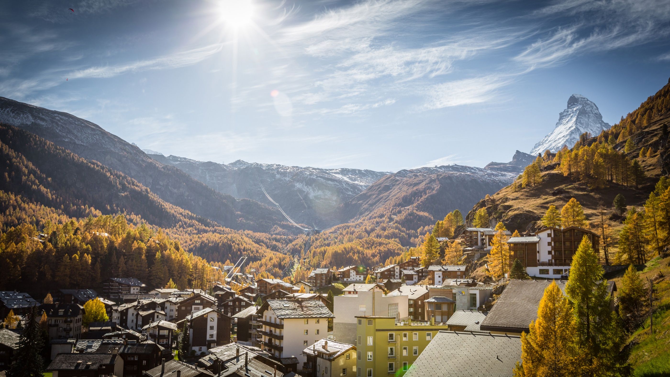 Zermatt in autumn: Colorful mountain landscape with a view of the Matterhorn and charming buildings.