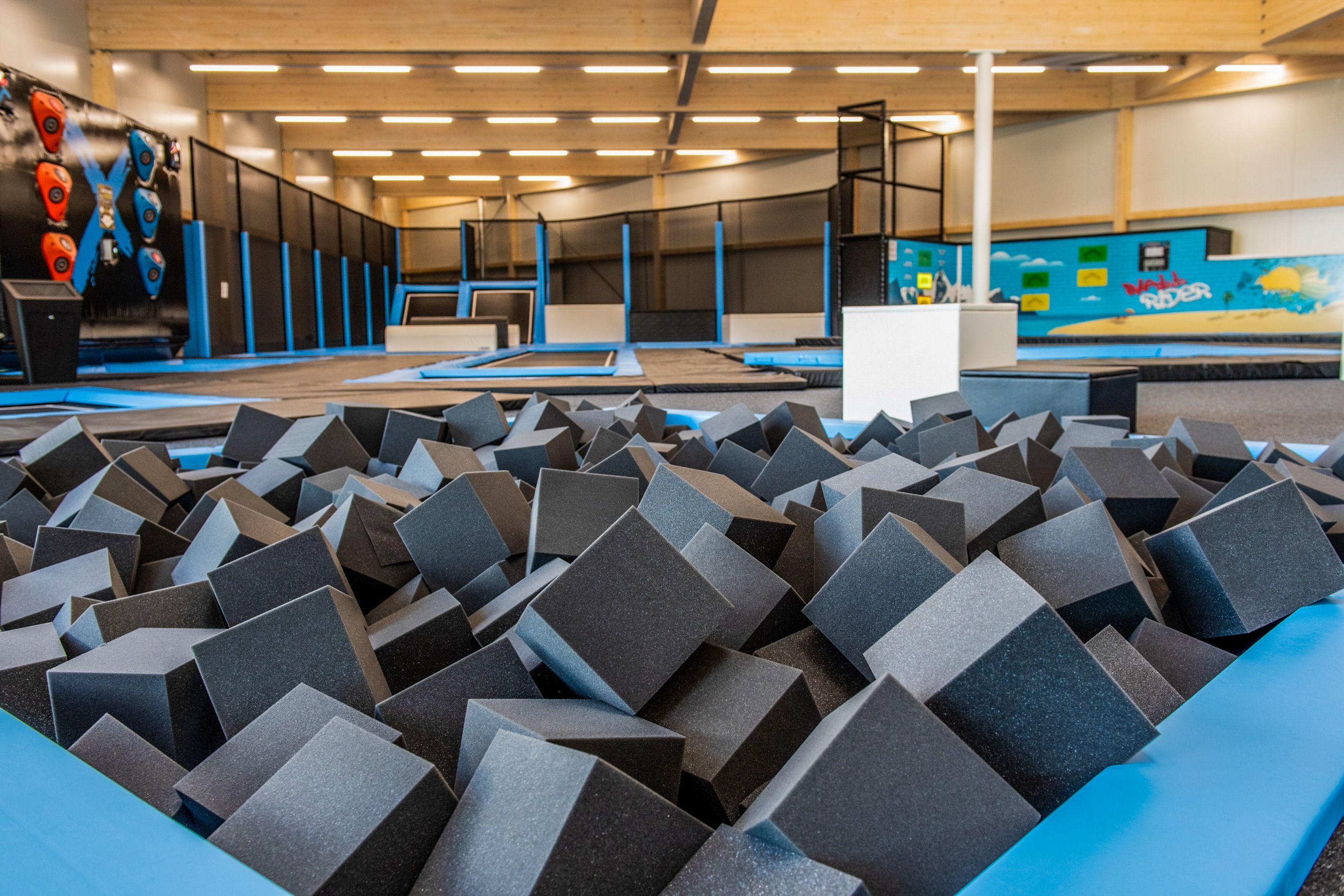 Foam Pit: Trampoline area in Xstream Park with soft foam blocks for safe hopping and jumping.
