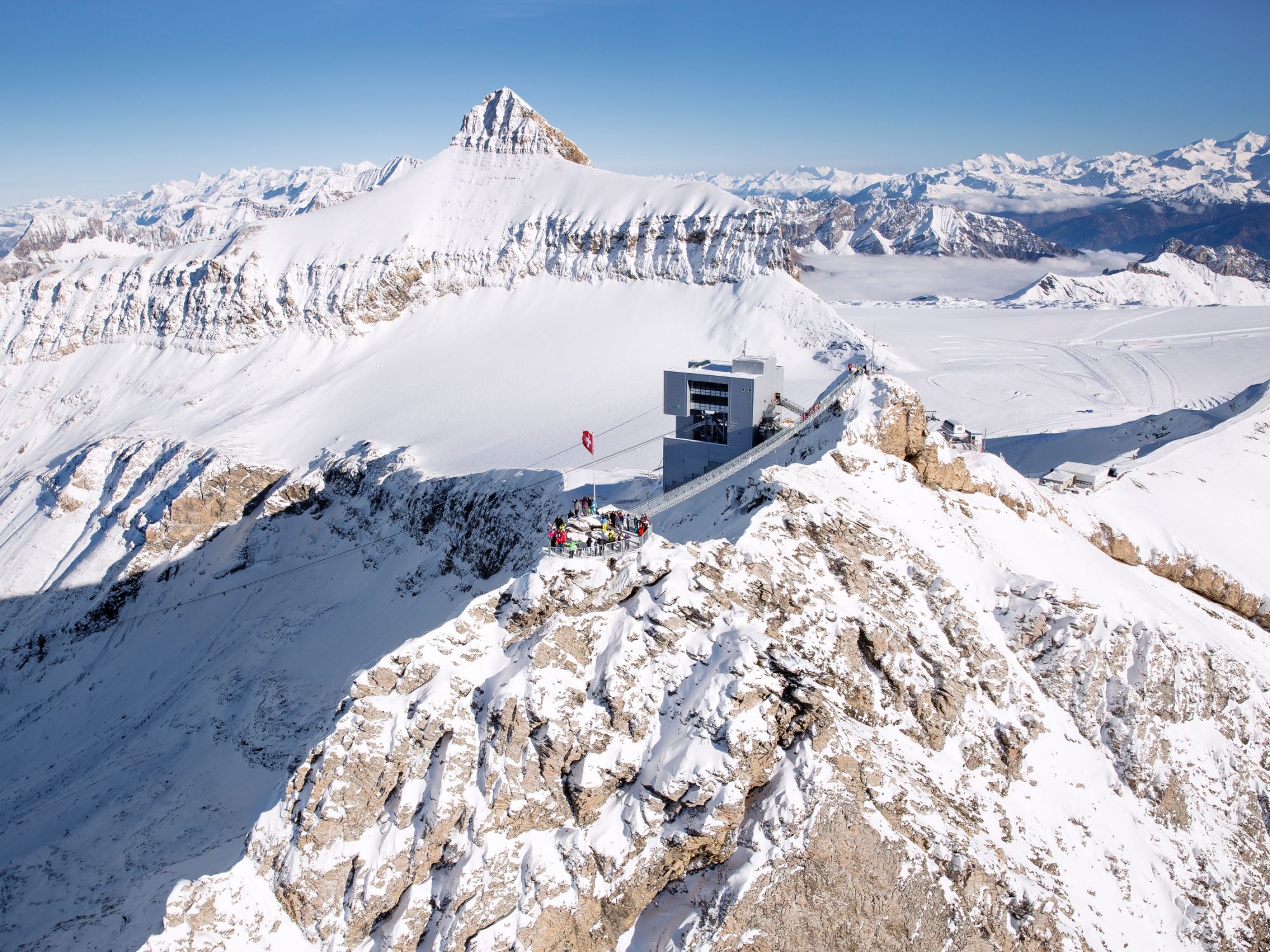 Glacier 3000: Explore the Peak Walk Tissot in Switzerland with magnificent mountain views.