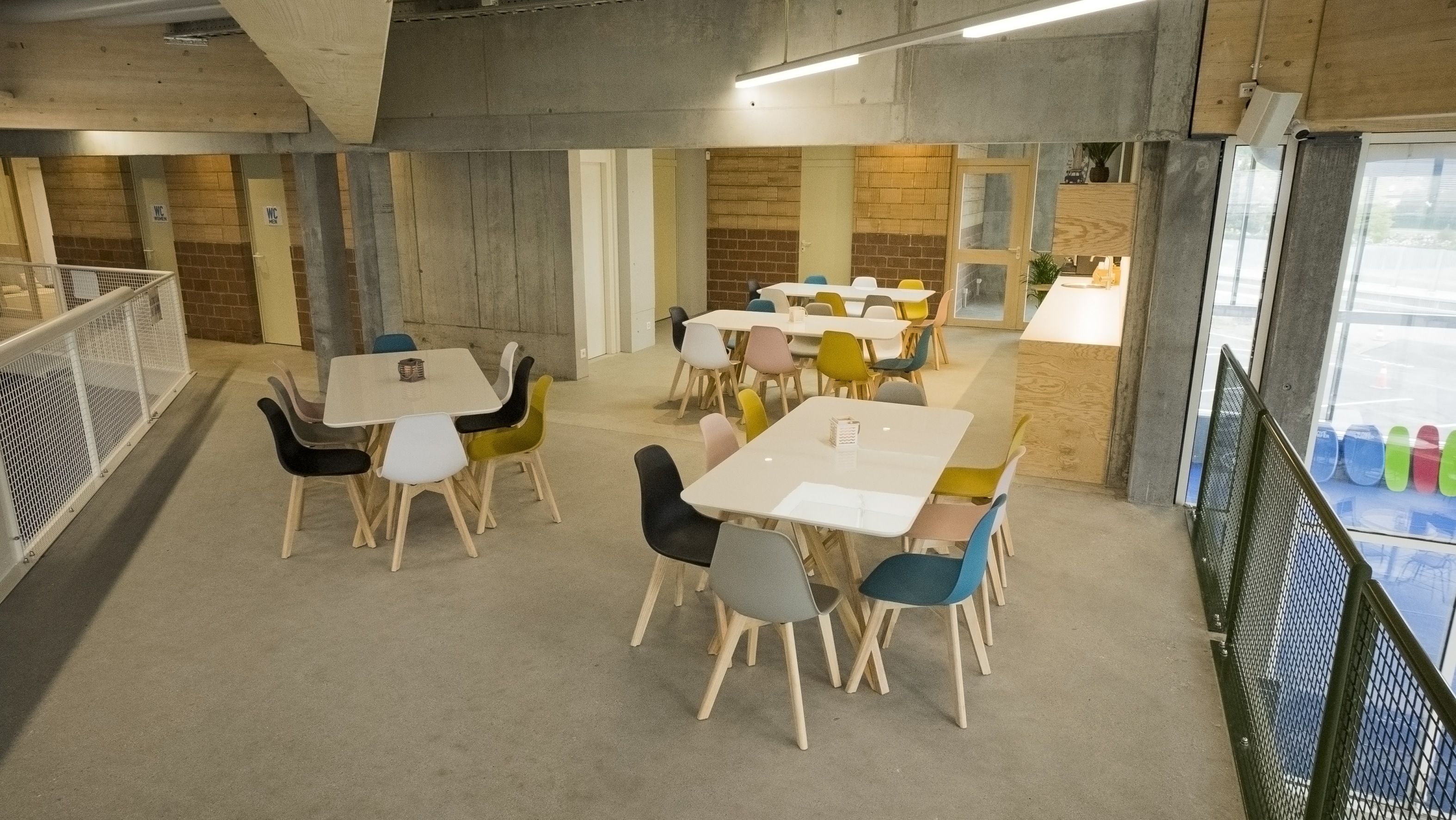 Space for celebrations in Xstream Park with stylish tables and chairs for group activities.