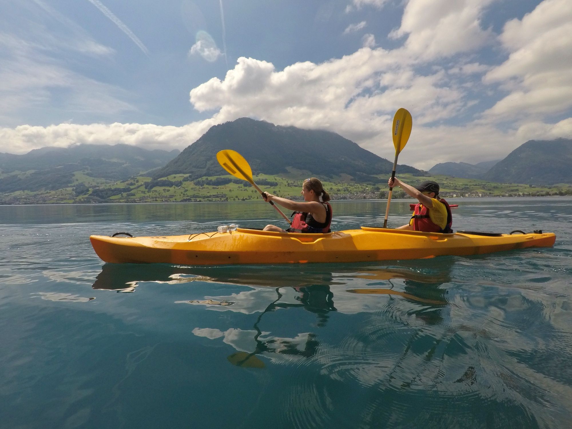 Kayak tour on Lake Lucerne with impressive mountains in the background.