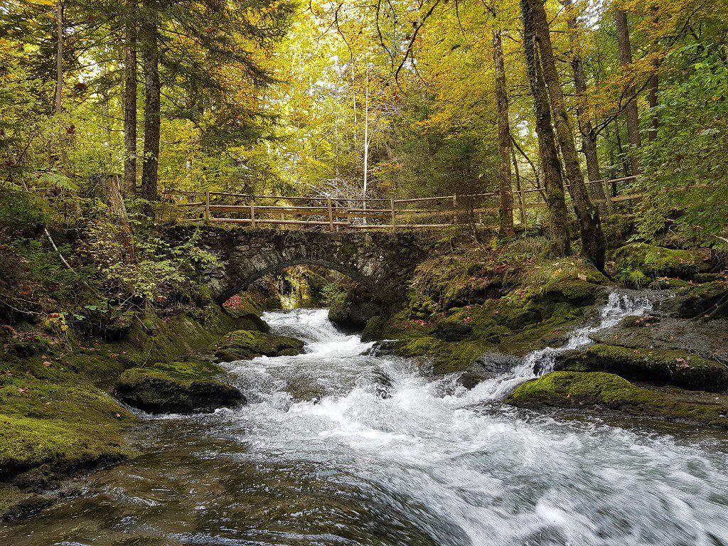 River with bridge and waterfall in the gorge