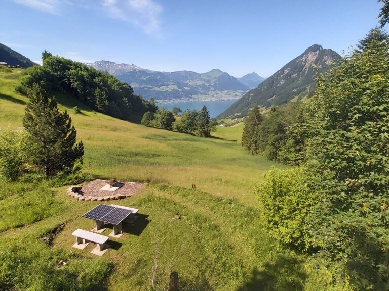 Pouring concrete on the Rigi in a green landscape with a view of the lake.