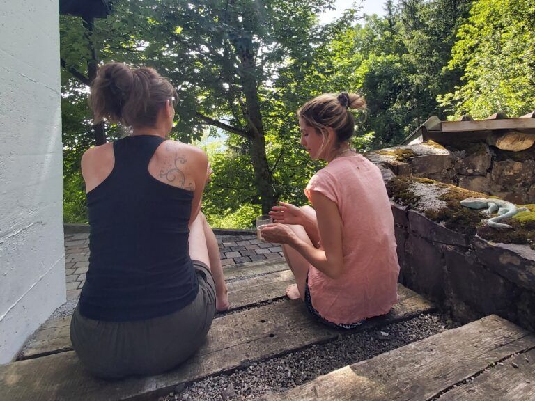 Two women pouring concrete on the Rigi outdoors.