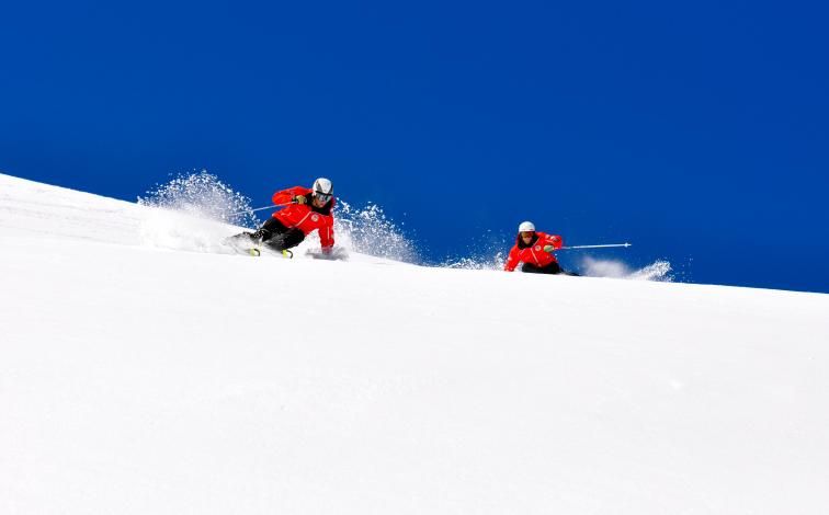 Ski tour Zermatt with skiing people on snow