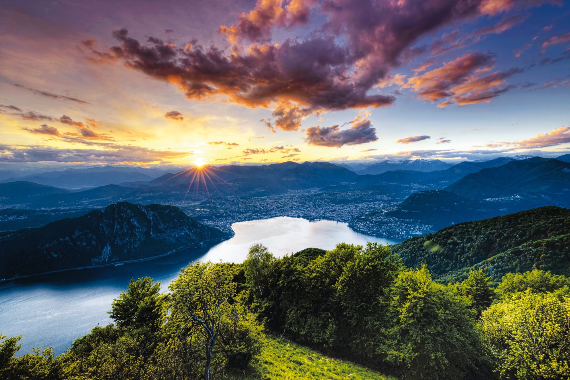 Lugano sunset over the lake in the mountains, peaceful atmosphere