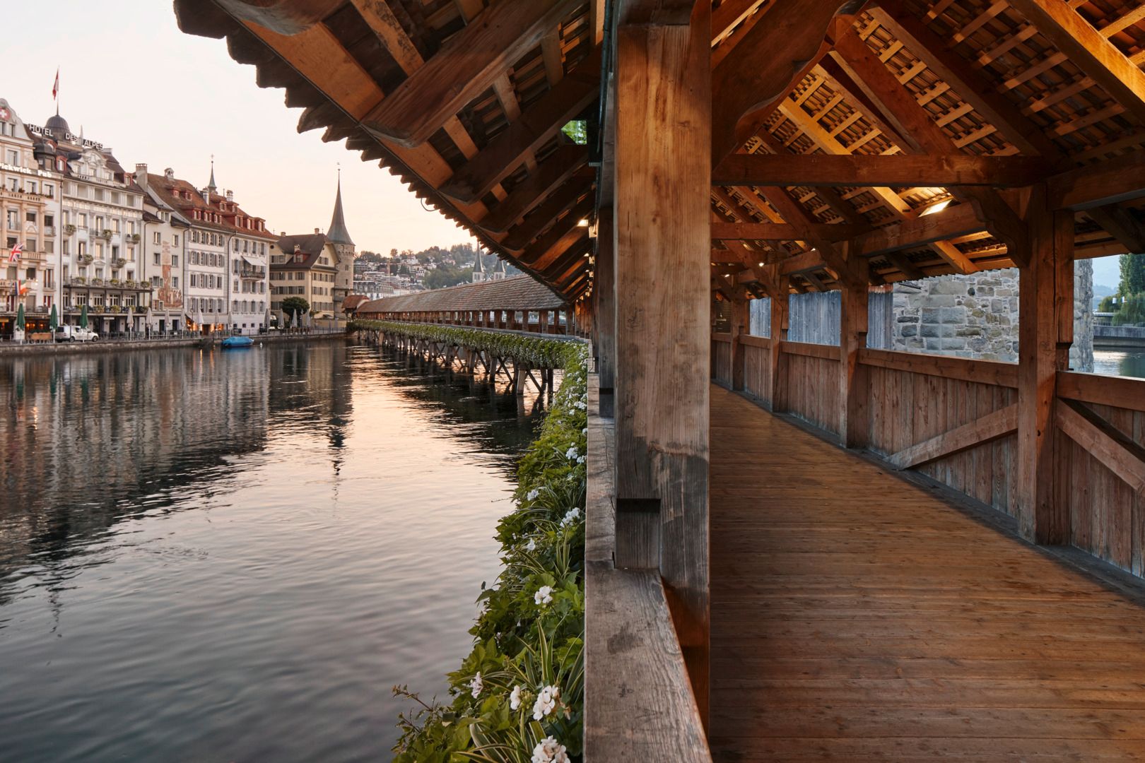Lucerne Chapel Bridge over the Reuss with historic wooden construction and city view