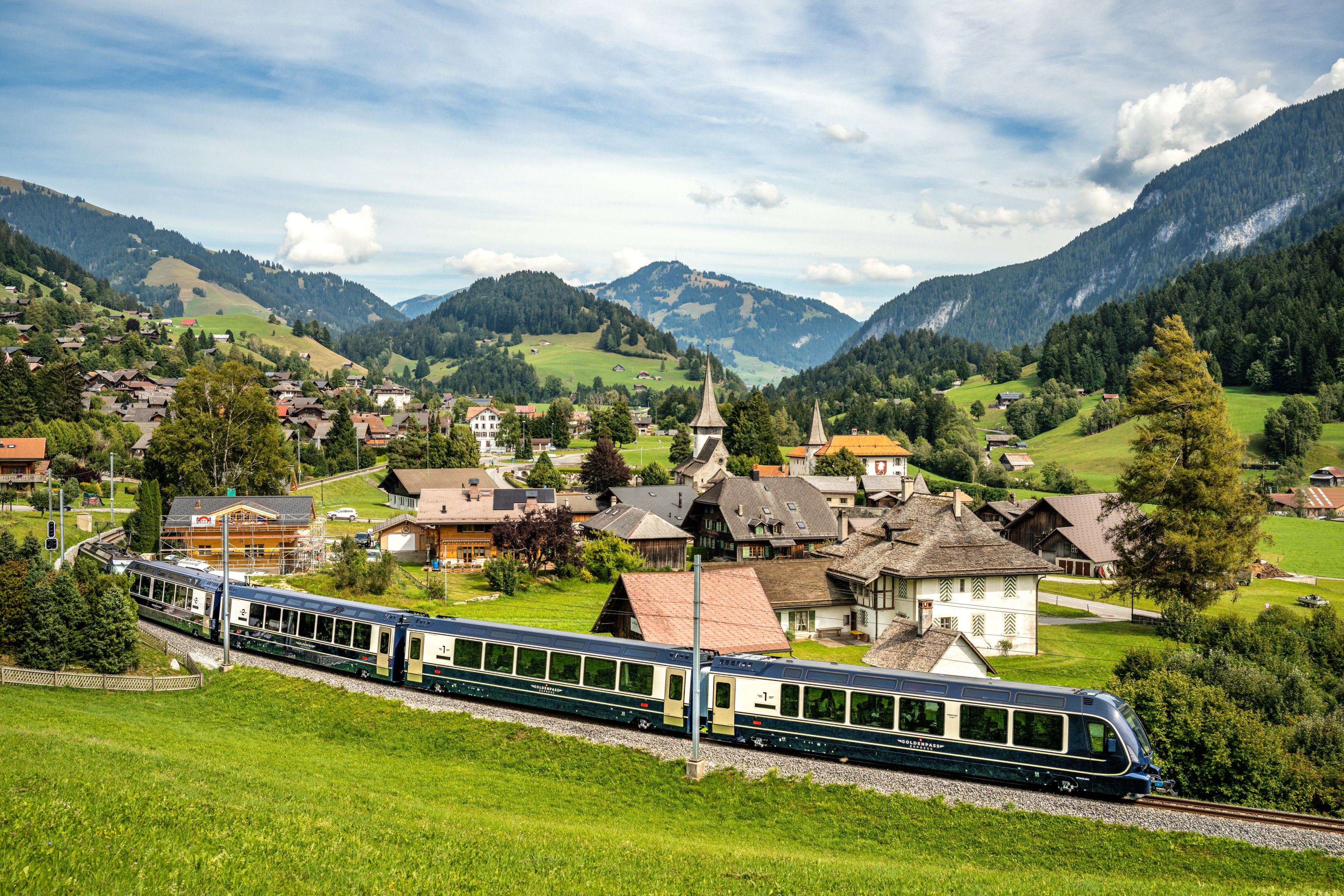 Golden Pass Line: Discover the picturesque landscape of Switzerland with mountains and the train.