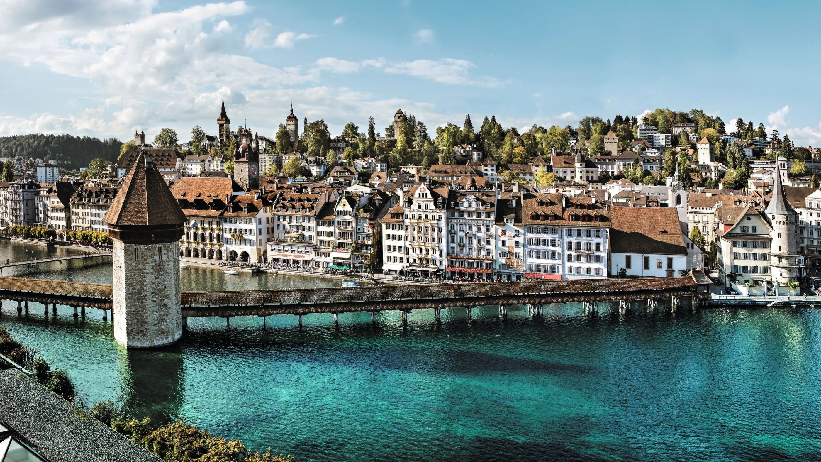 Lucerne Chapel Bridge with water and city view in the background