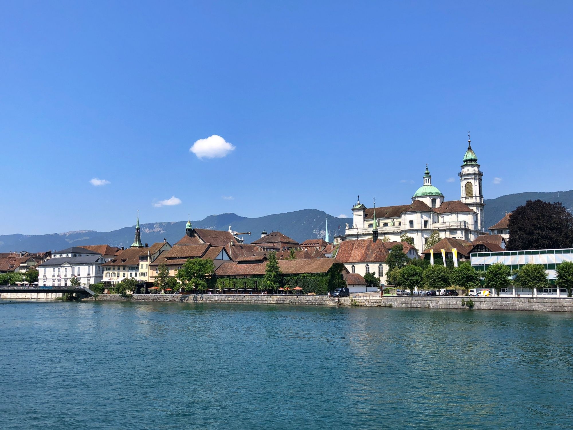 Solothurn: picturesque old town by the water with historic buildings and green shores in Switzerland.