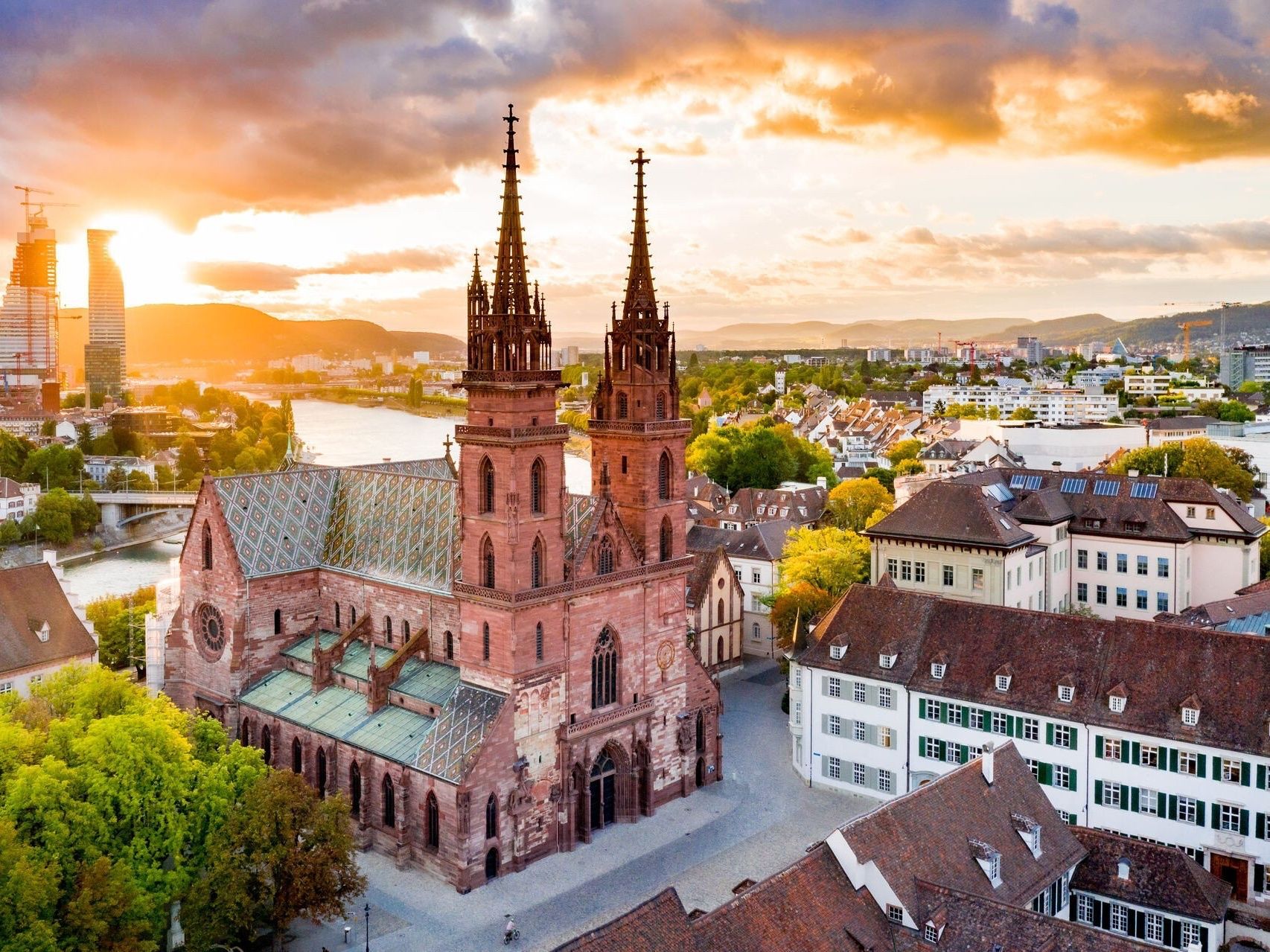 Basel: Historical architecture with city view and sunset, perfect for culture and history enthusiasts.