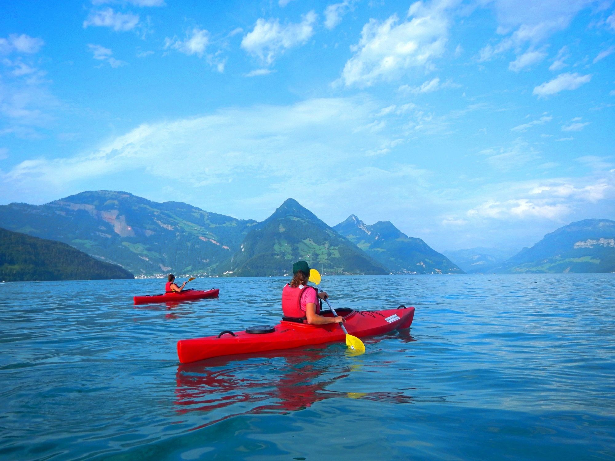 Kayak tour on Lake Lucerne with surrounding mountains and refreshing activity.
