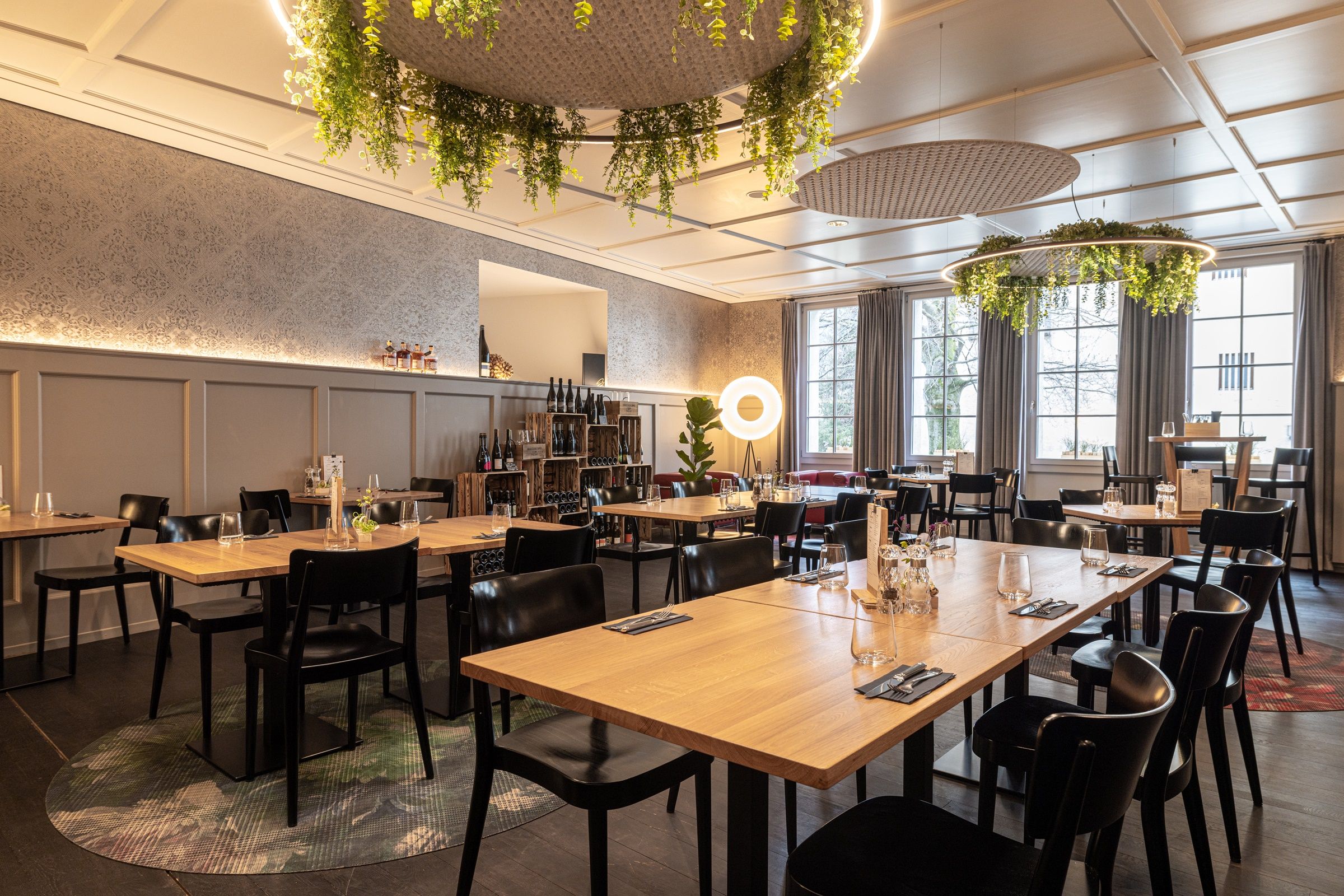 Wine and art tour with tasting in a stylish restaurant featuring modern elements and a cozy atmosphere.