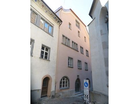Antistitium House front in Chur. Historic building between narrow streets with a characteristic style.