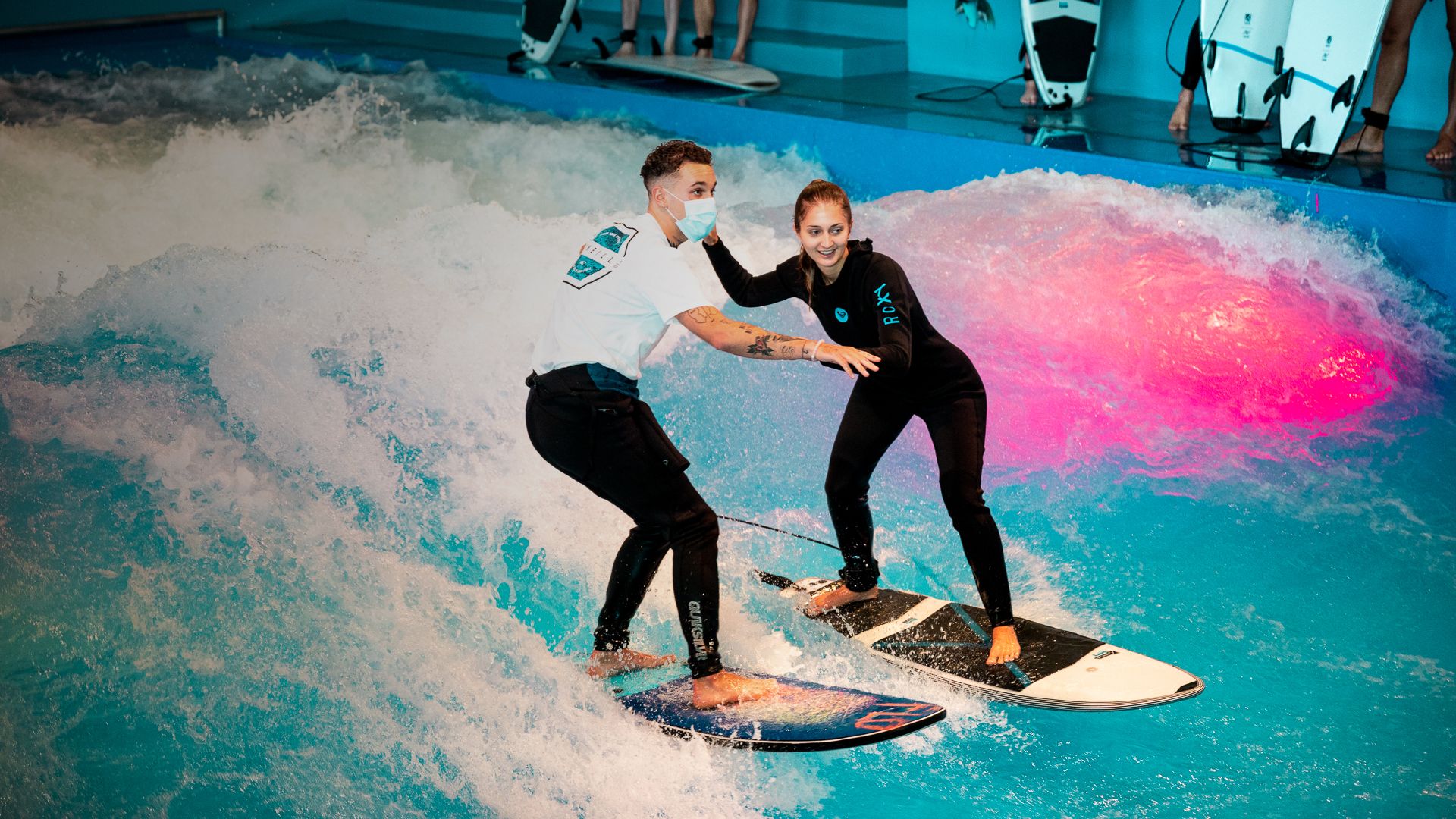 Oana Surf Private Coach shows individual surfing techniques in a training session. Water sports, surfing, indoor, 2023