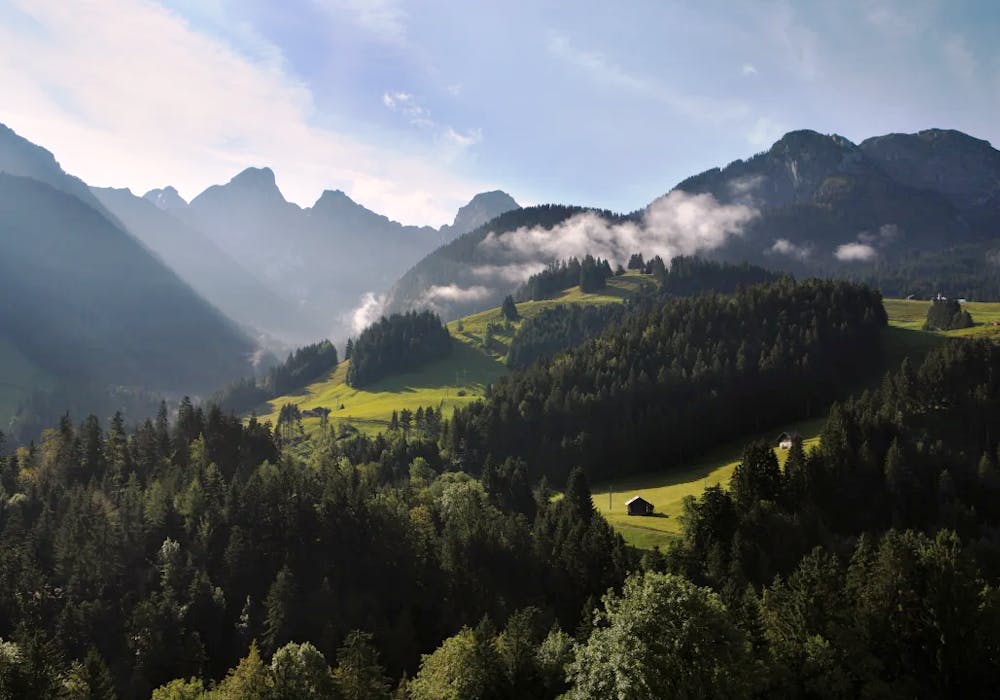Château-d'Oex Gummfluh with green mountain panorama in summer.
