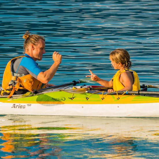 Kayaking on Lake Brienz with family on a sunny day.