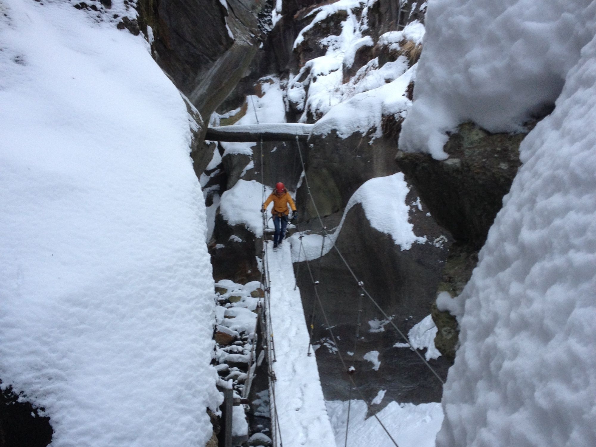 Winter via ferrata in the mountains: exciting adventure tour in the snow for groups and children.