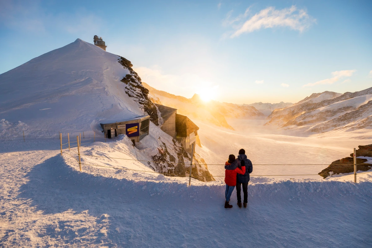 Jungfraujoch: Romantic sunrise over the Aletsch Glacier and snow-covered mountains.