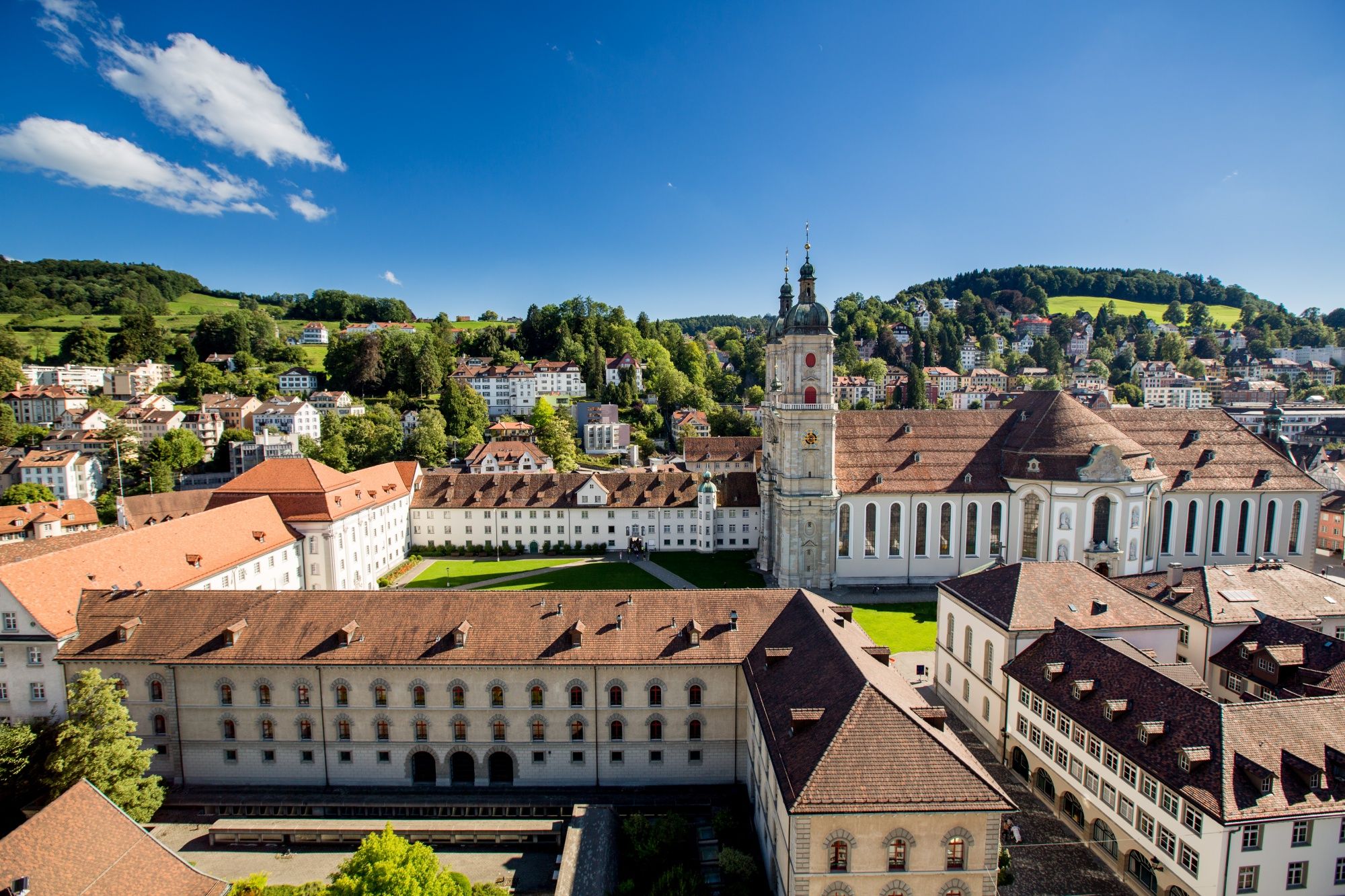 Abbey District Lucerne with buildings, green landscape and blue sky