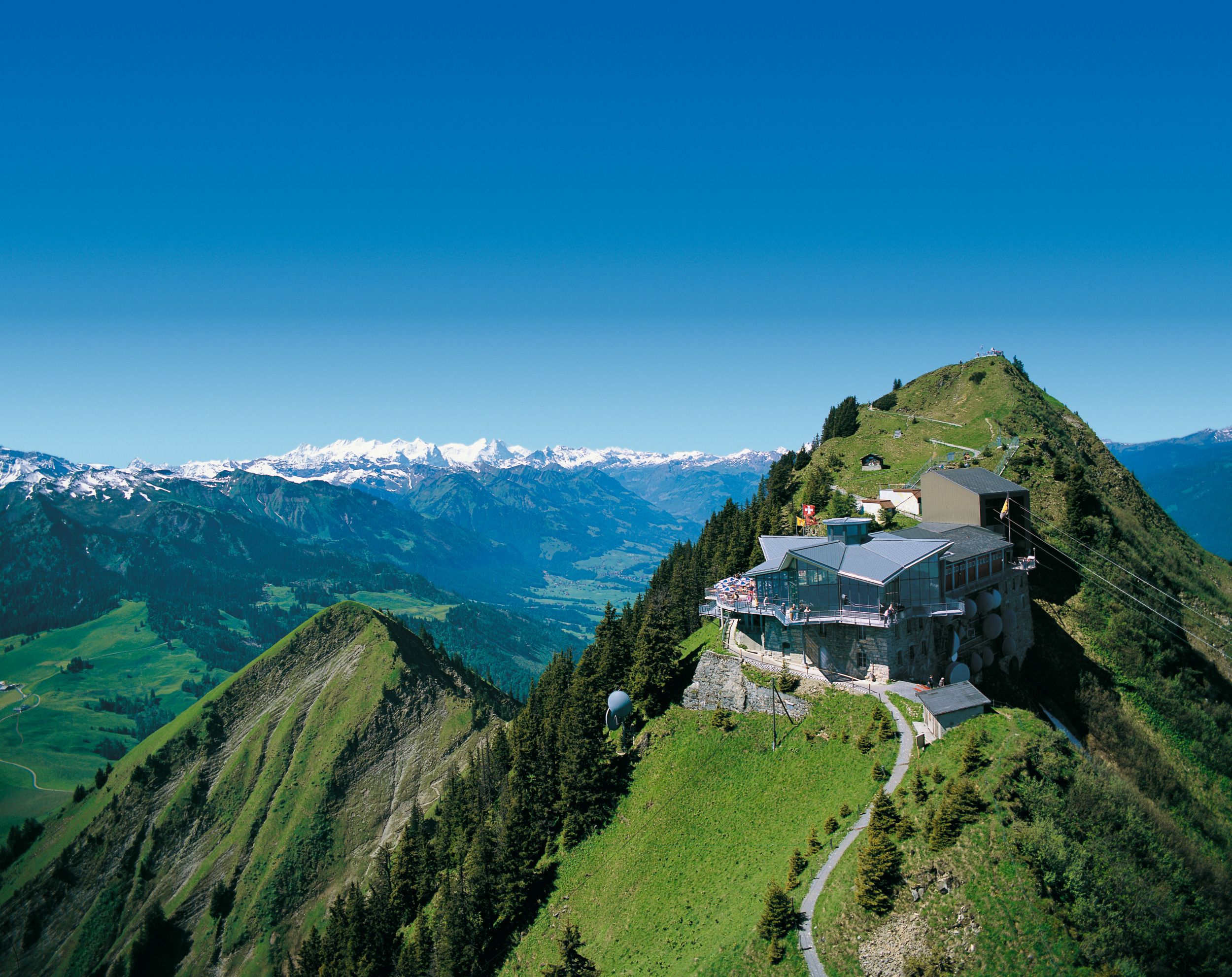 Stanserhorn: impressive view from the mountain restaurant over the surrounding Alps and forests.