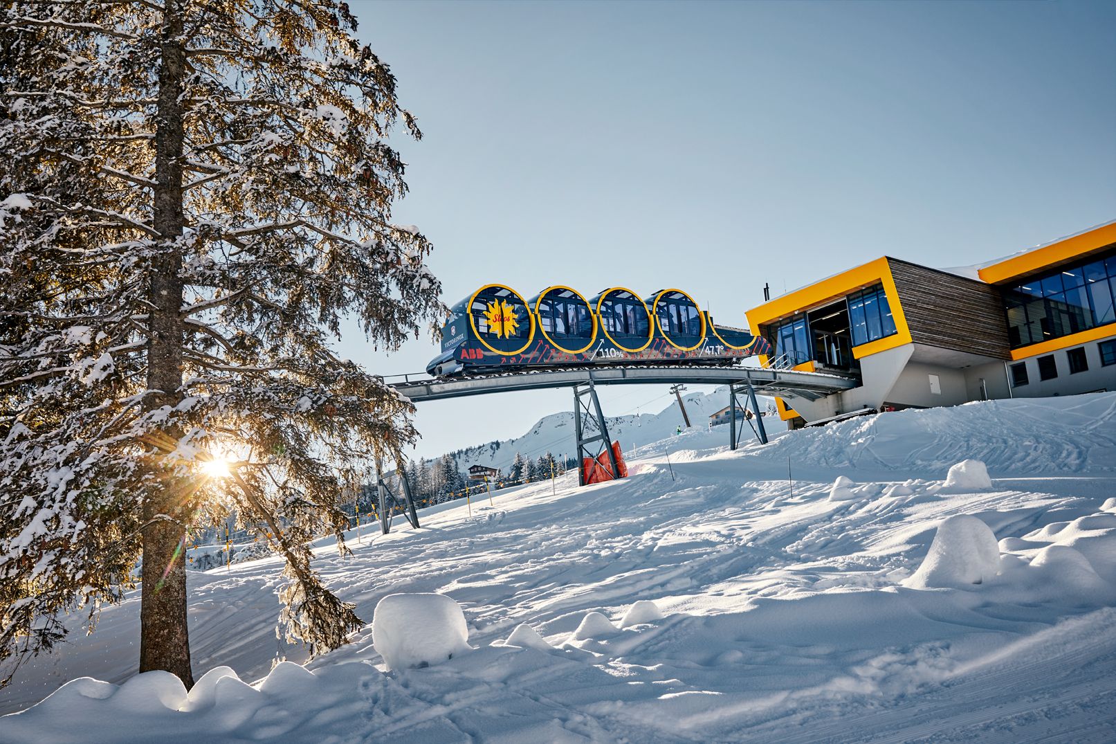 Stoosbahn Winter: Experience the impressive mountain railway in the snowy Swiss autumn landscape.