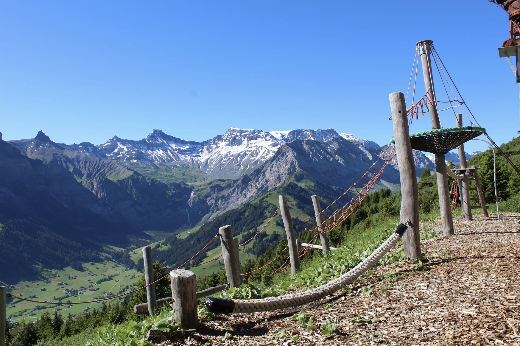Tschentenalp Playground with Mountain View and Playground Equipment.