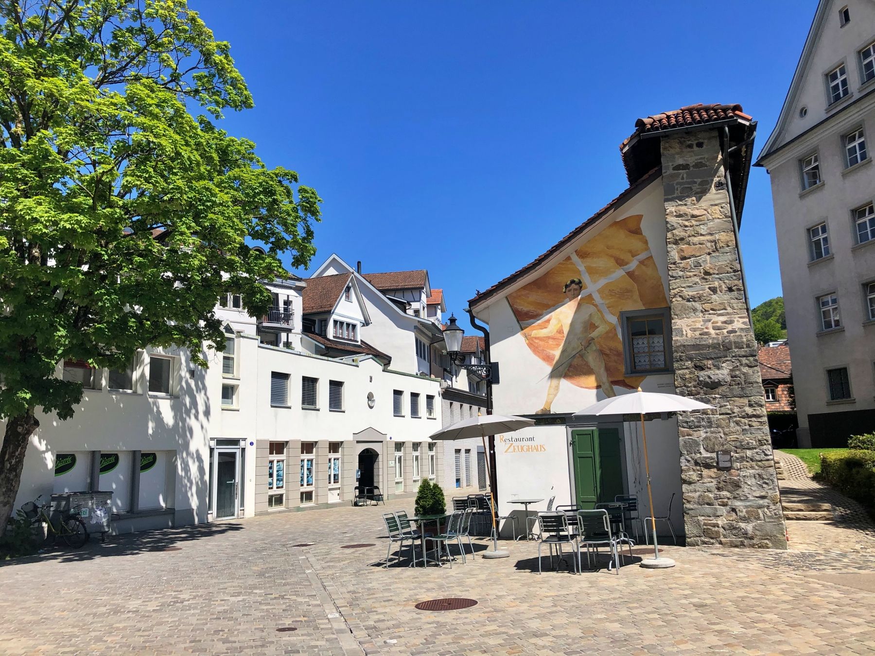 Restaurant Zeughaus St. Gallen with outdoor seating, sunny day in 2023.