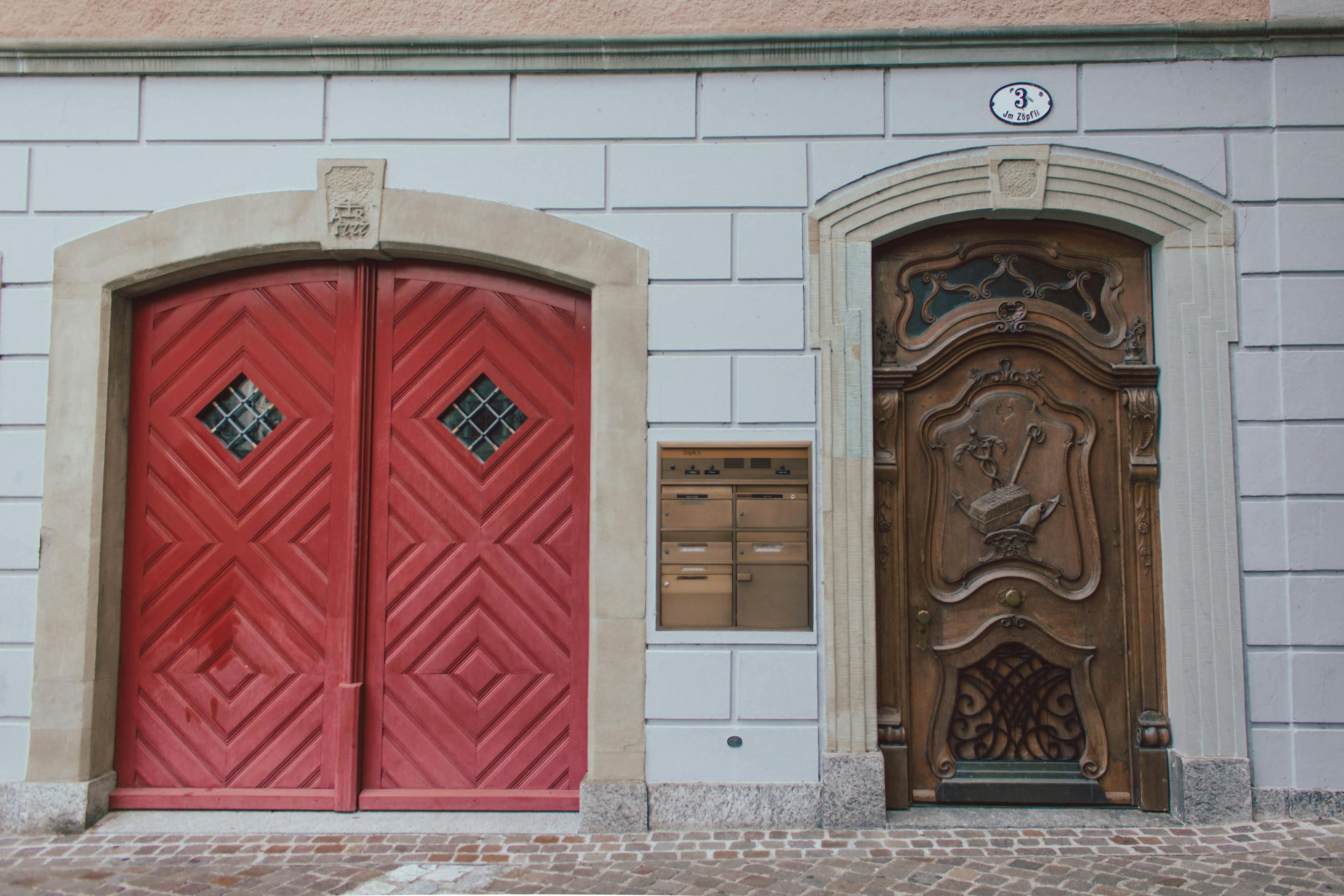 Red and wood door in Lucerne with box