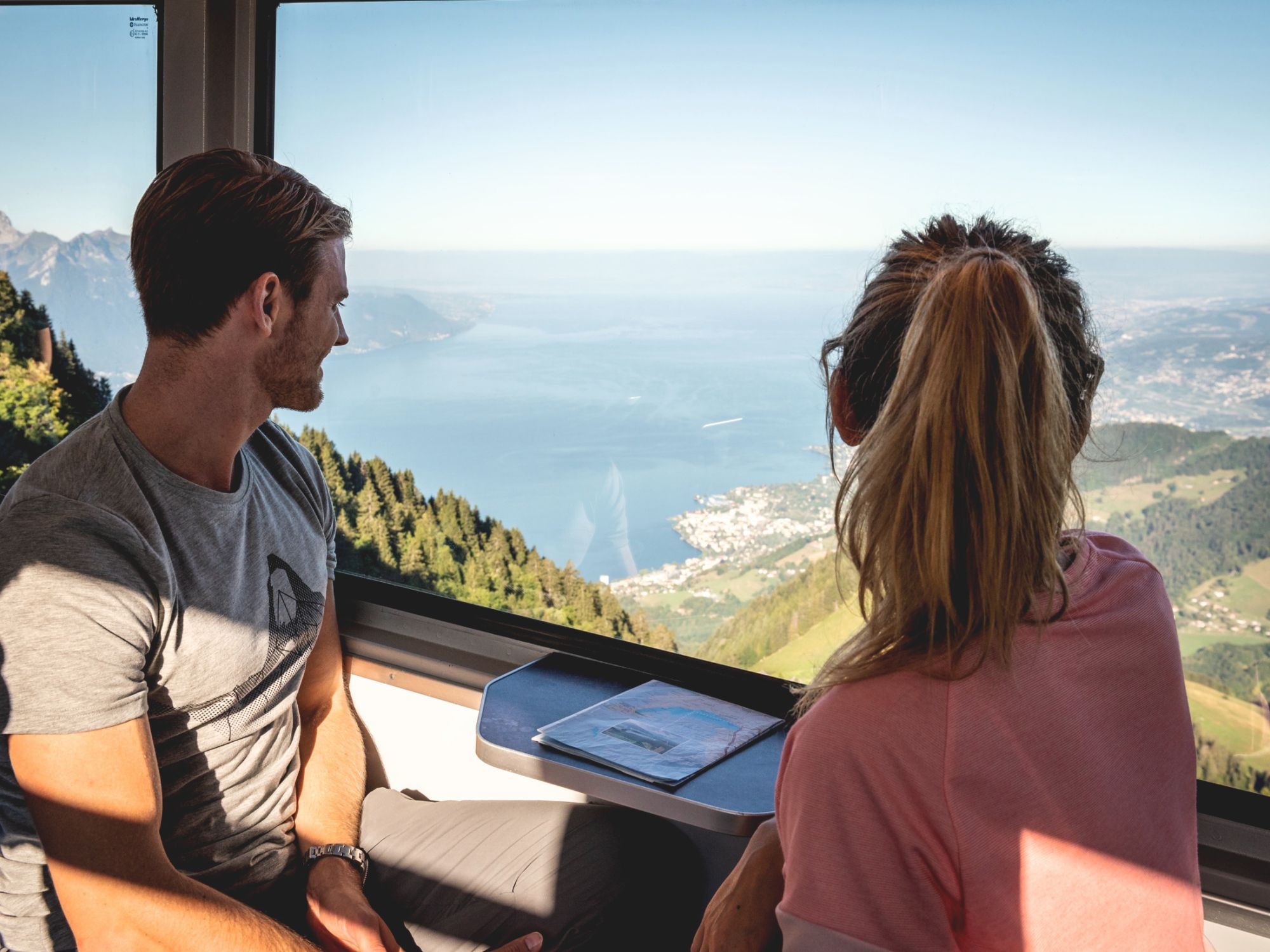 Cog railway at Rochers de Naye with a view of Lake Geneva and the Alps.