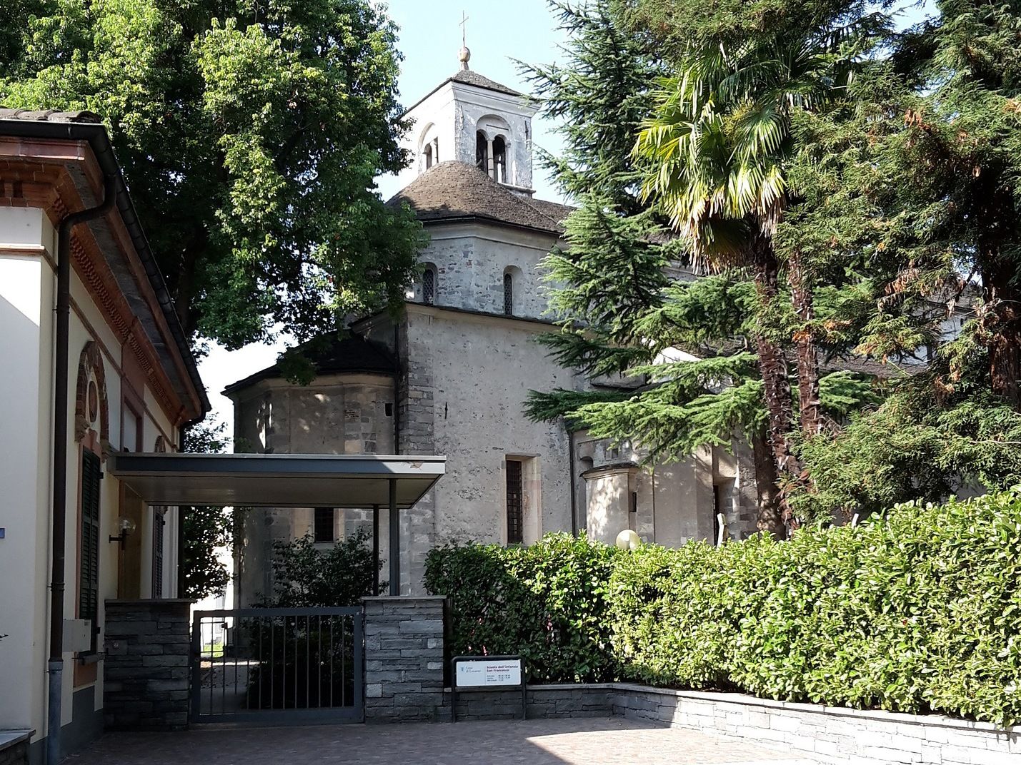 Church in Locarno with trees, ideal for romantic outings and group activities.