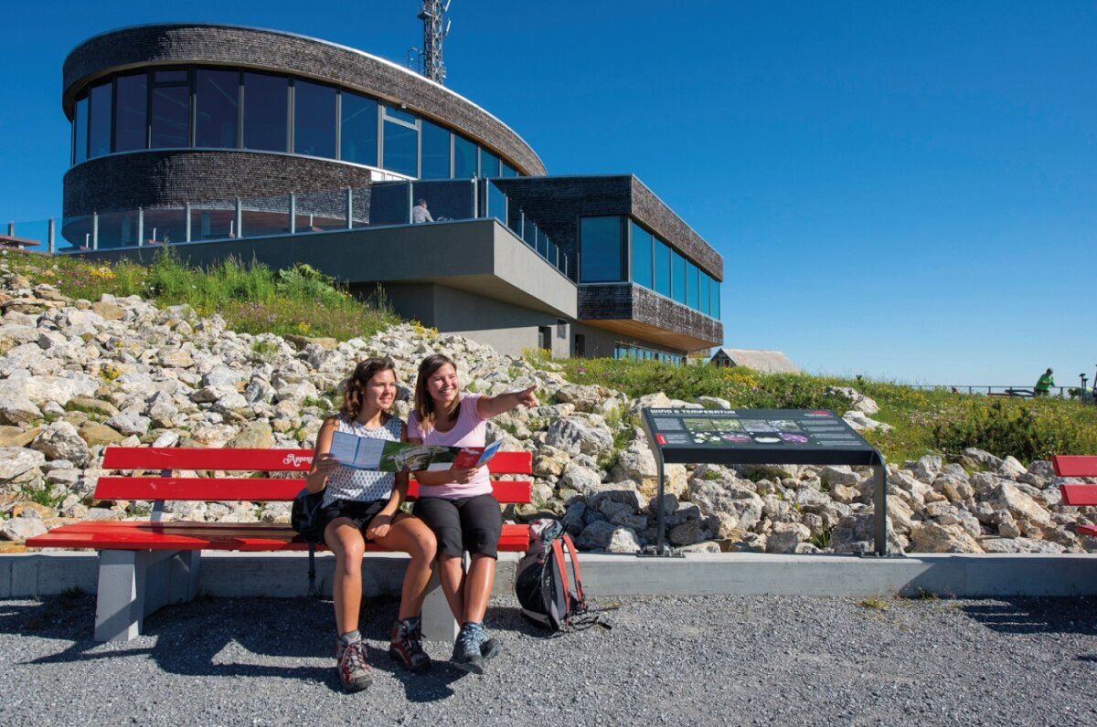 Restaurant Appenzell with guests on a bench, friendly atmosphere, view