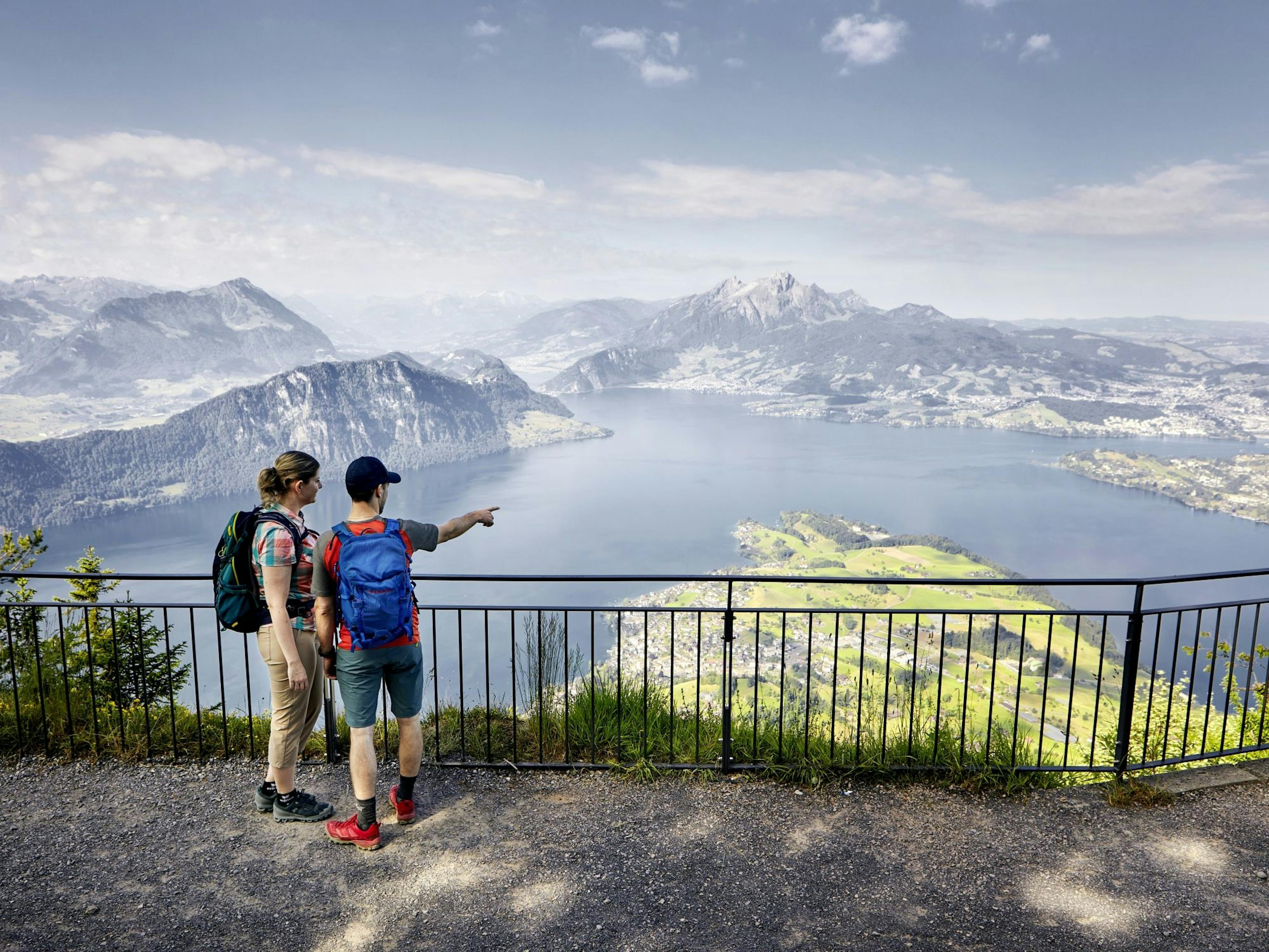 Rigi: View from Rigi over Lucerne and Lake Lucerne, hikers enjoy nature.