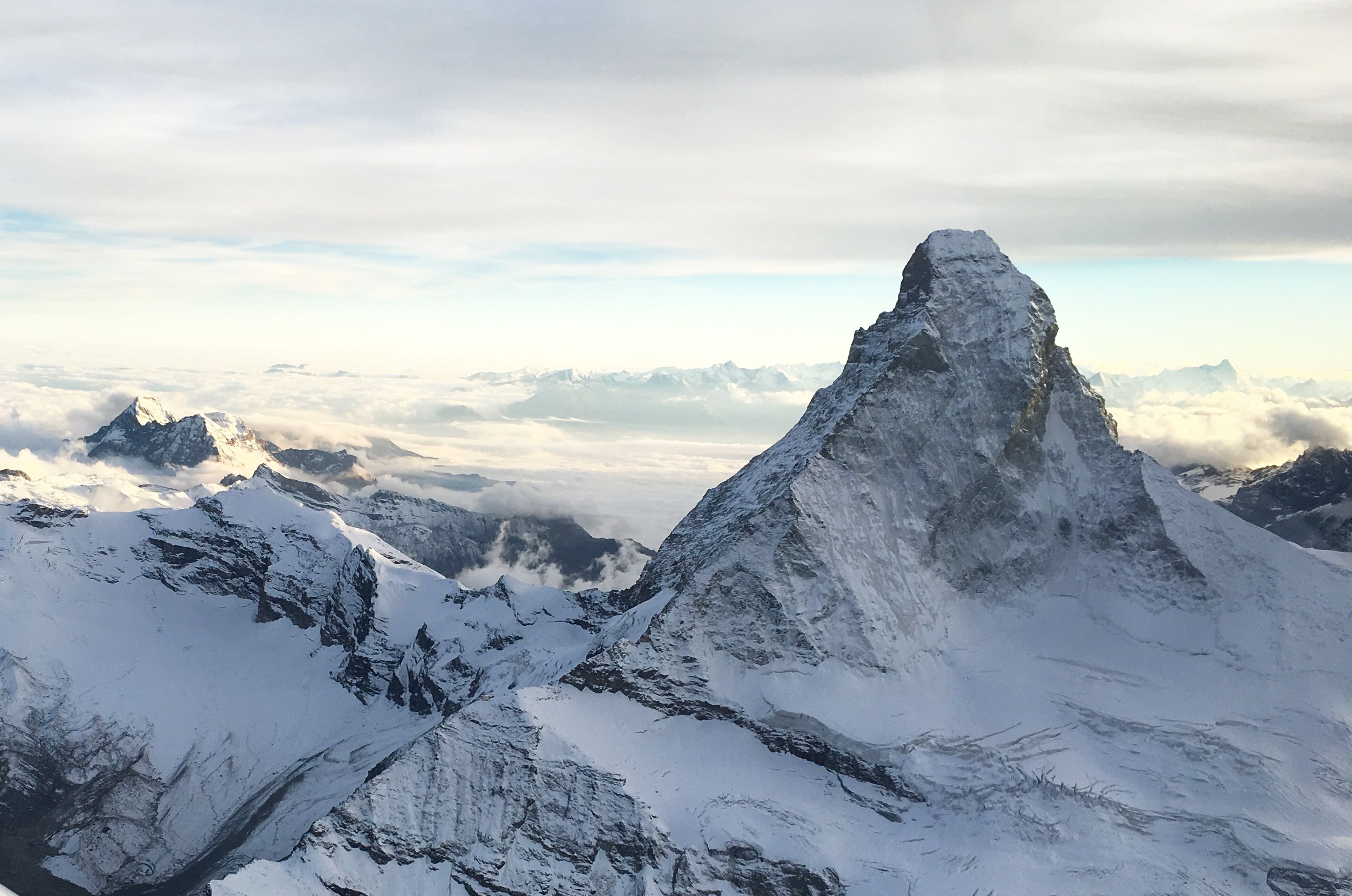 Matterhorn in Alpine scenic flight, helicopter view, snow, mountain landscape