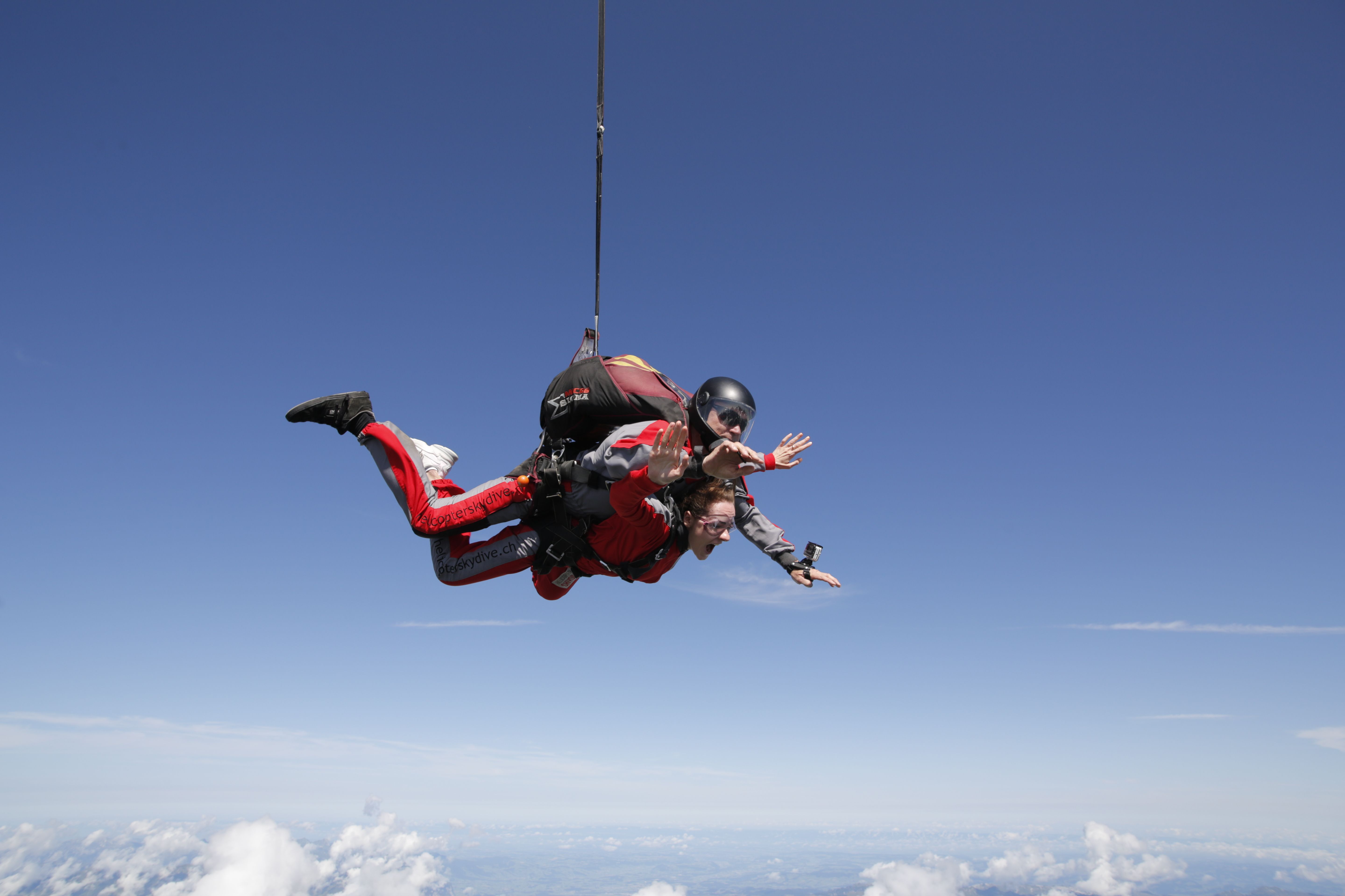 Skydiving Free Fall over Bern with a Skydiver and Tandem Partner.