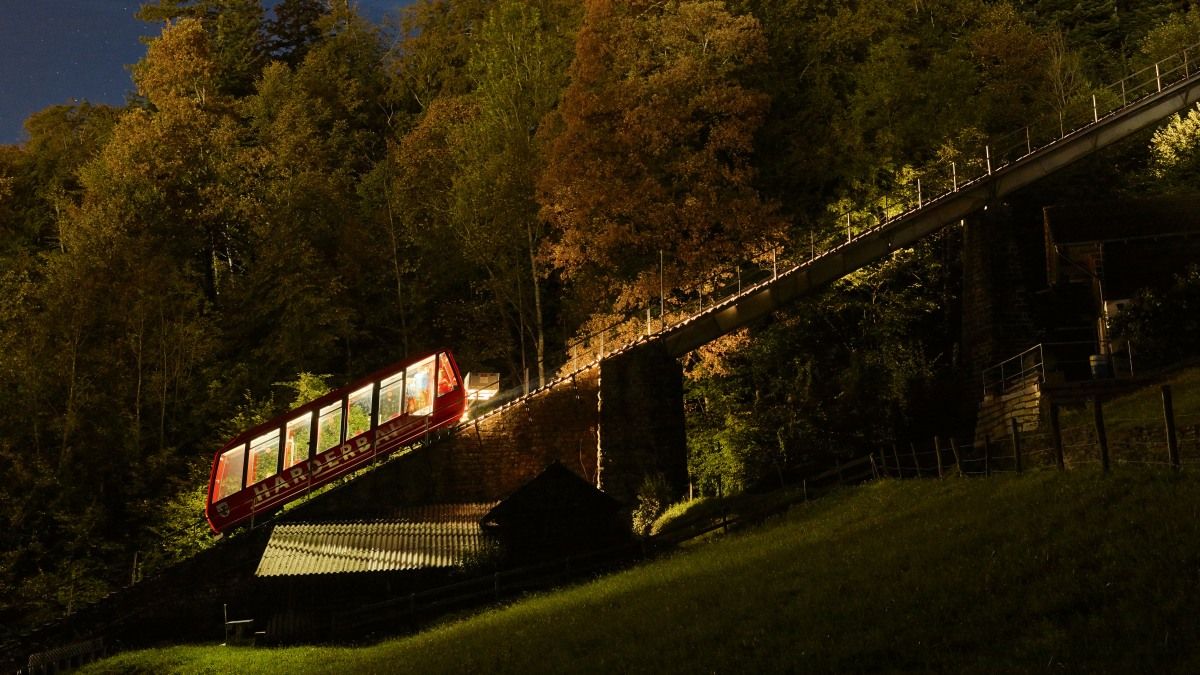 Harderbahn evening ride to Harder Kulm in Interlaken, fascinating mountain view at night.